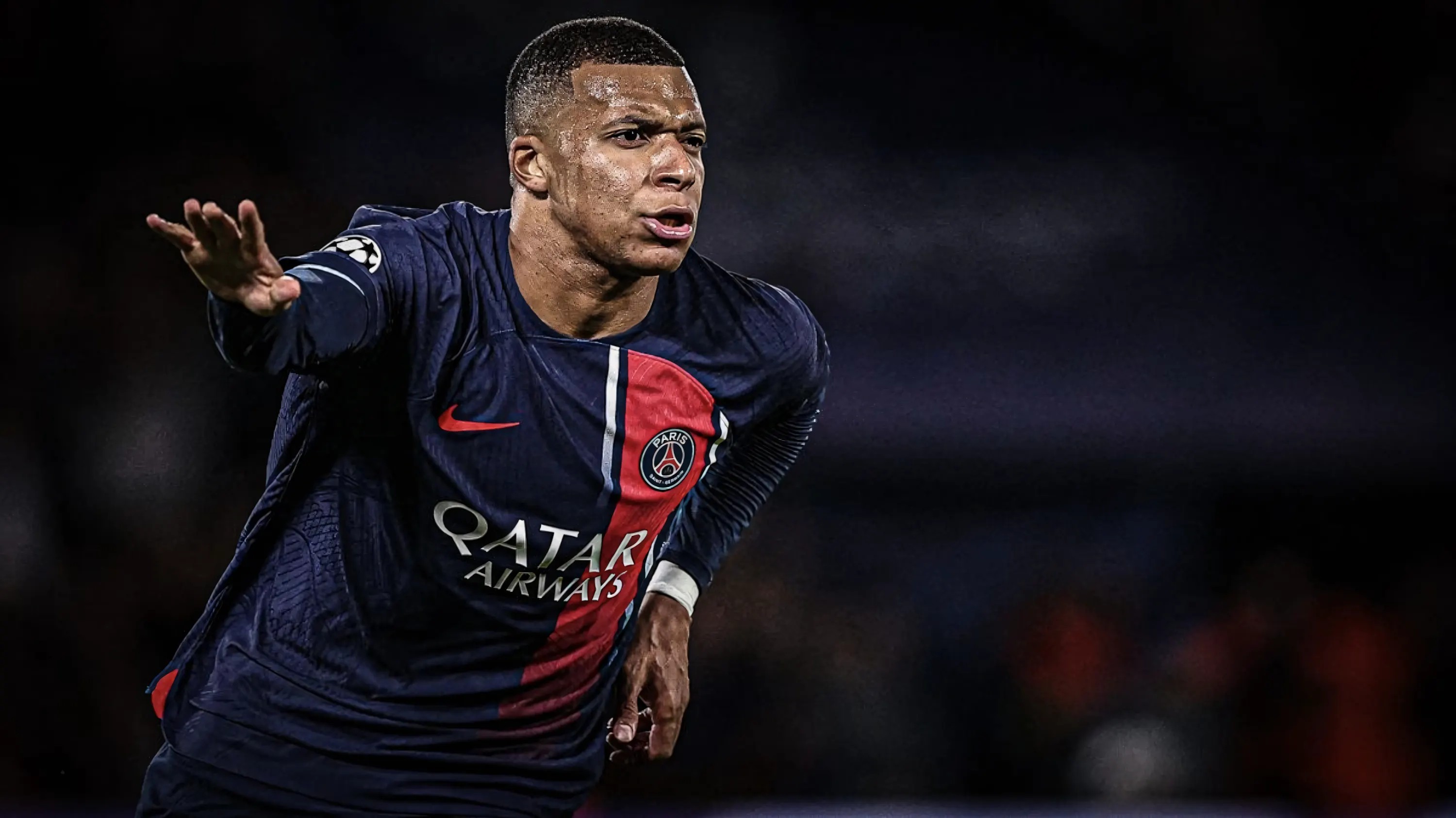 Mbappé dang tay ăn mừng trên màn hình desktop